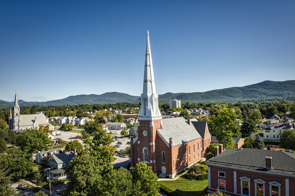 Aerial view of Grace Church in Rutland with the mountains in the background